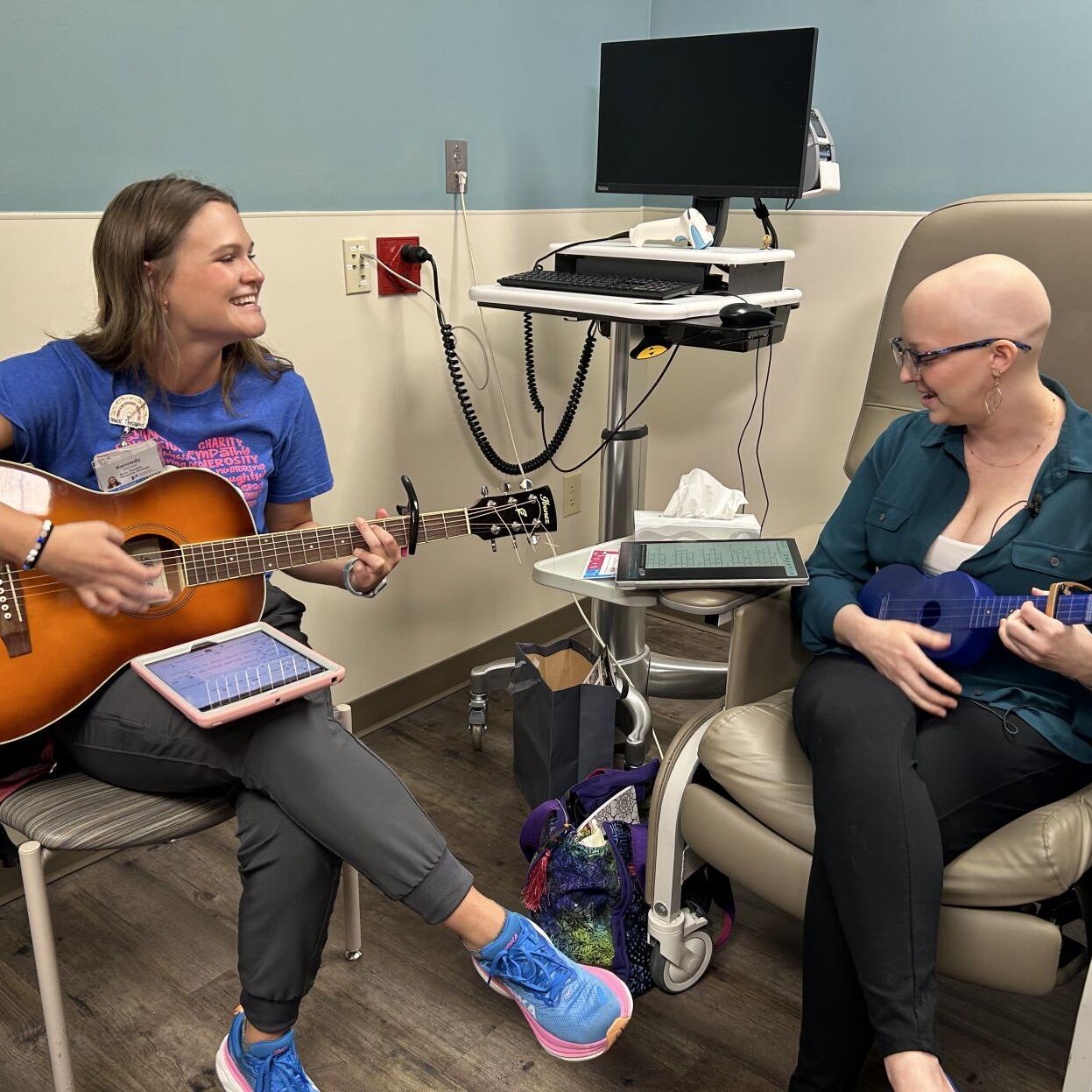 Kennedy McCollam and Gillian Hollis play guitars.jpg